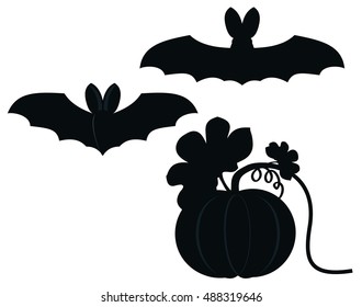 Two night bat are flying near pumpkin. Black and white