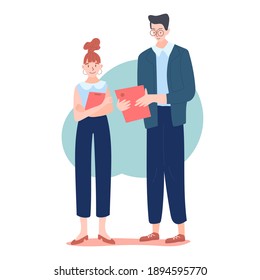 Two office workers talking to each other and holding office folders or documents. Stylish modern office look. The tall man and the woman with red hair. Coworkers, team members, or couples.