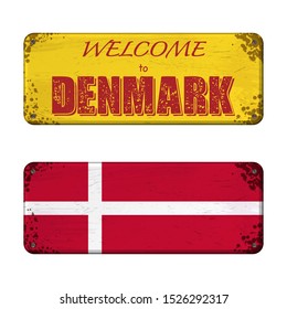 Two old grunge boards with Denmark flag and welcome text