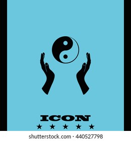 Two opened hands holding Yin Yang symbol.