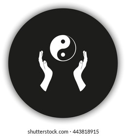 Two opened hands holding Yin Yang symbol.