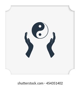 Two opened hands holding Yin Yang symbol.