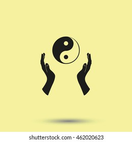 Two opened hands holding Yin Yang symbol.