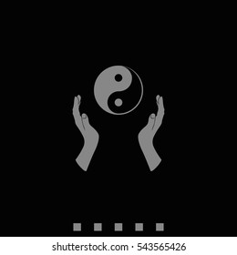 Two opened hands holding Yin Yang symbol.