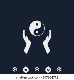 Two opened hands holding Yin Yang symbol.