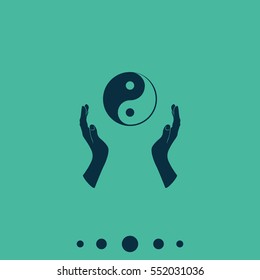 Two opened hands holding Yin Yang symbol.