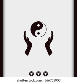 Two opened hands holding Yin Yang symbol.