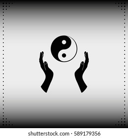 Two opened hands holding Yin Yang symbol.