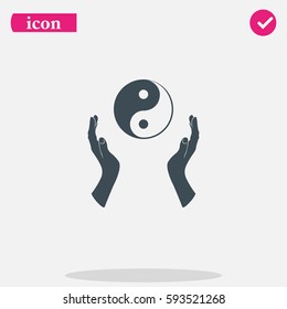 Two opened hands holding Yin Yang symbol.