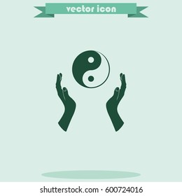 Two opened hands holding Yin Yang symbol.