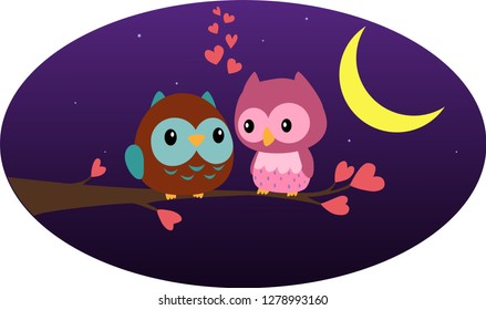 Two owls in love sit on a branch at night. Valentine's Day.