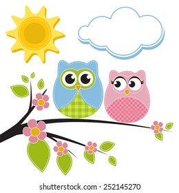 Two owls on the branch