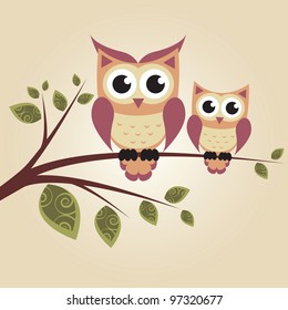 Two owls on the tree