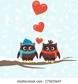 two owls on tree branches with hearts