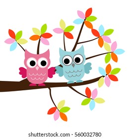 Two Owls sitting on the branch