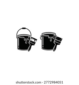 Two paint buckets with brushes