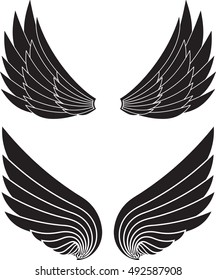 Two pairs of decorative vector wings isolated on white.