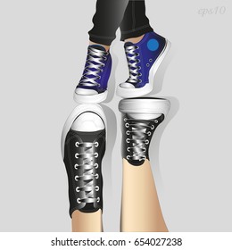 Two pairs of legs in sneakers
Image of a guy's legs in black shoes legs of a girl in blue shoes with laces composition of an acrobatic effect