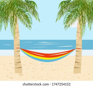 Two palm trees and a hammock between them on the beach