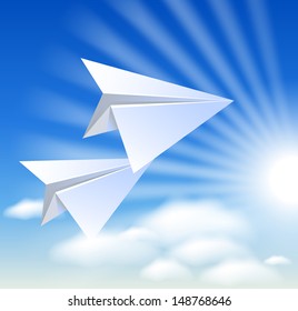 Two paper airplane in the blue sky