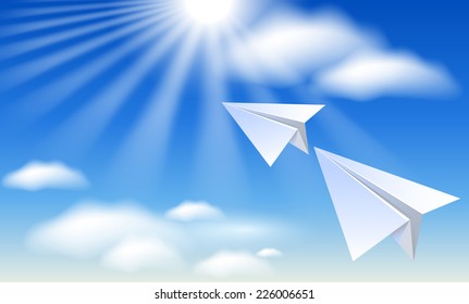 Two paper airplane in the blue sky