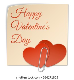Two paper heart attached to the sticker with text happy valentines day using the clip.