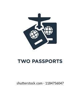 Two Passports icon. Black filled vector illustration. Two Passports symbol on white background. Can be used in web and mobile.