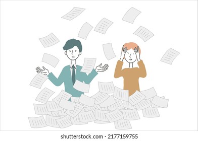 Two people buried in a pile of papers