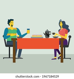 Two people eating at a table.