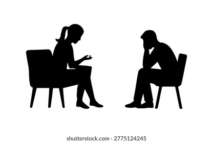Two people sitting in chairs having a discussion or counseling session