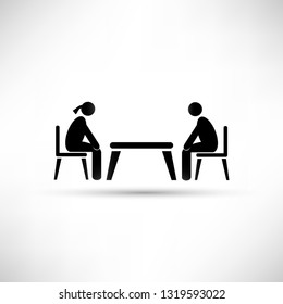 two people at the table icon.
