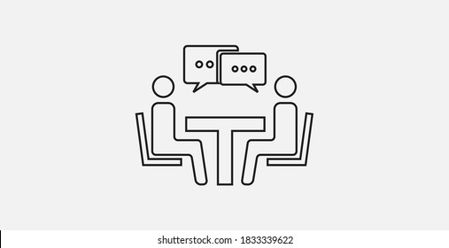 Two people at the table icon. Talking icon. Conference icon. People sitting around the table talking.