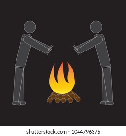 two people are warming themselves near the fire