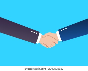 Two people wearing tailored suits shake their hands as a sign of agreement or success
