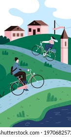 Two persons riding vintage city bikes on the green hills in the countryside landscape. Town houses and the tower on the background