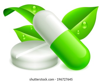 Two pills and green leaves.