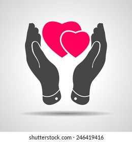 two pink hearts icon in careful hands - vector illustration