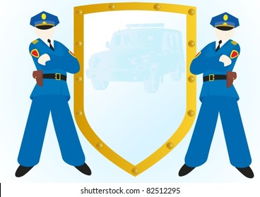 Two police officers standing near the shield with the image of the police car