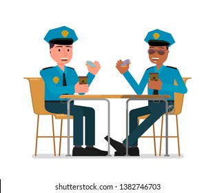 Two policemen have lunch sitting at the table. Isolated on a white background.