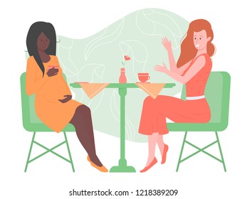 Two pretty girls friends are sitting in a cafe. One of them is pregnant. Drink tea, talk, support each other. Community of mummies, female friendship, pleasant leisure, different nationalities.