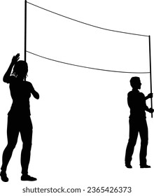 Two protestors or demonstrators at a demonstration march, picket line or strike protest rally in silhouette. Holding up a banner sign.