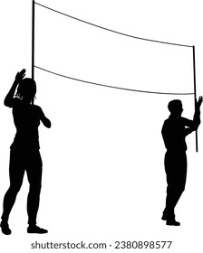 Two protestors or demonstrators at a demonstration march, picket line or strike protest rally in silhouette. Holding up a banner sign.