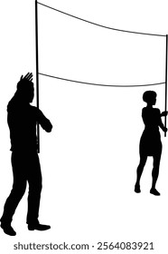 Two protestors or demonstrators at a demonstration march, picket line or strike protest rally in silhouette. Holding up a banner sign.