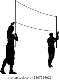 Two protestors or demonstrators at a demonstration march, picket line or strike protest rally in silhouette. Holding up a banner sign.