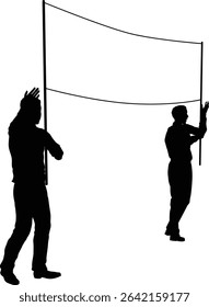 Two protestors or demonstrators at a demonstration march, picket line or strike protest rally in silhouette. Holding up a banner sign.