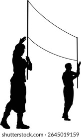 Two protestors or demonstrators at a demonstration march, picket line or strike protest rally in silhouette. Holding up a banner sign.