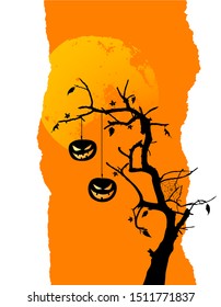 Two pumpkins are hanging on the tree. Halloween background with place for your text