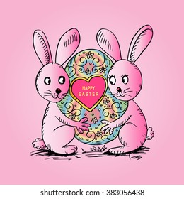 Two rabbits hugging a large Easter egg.