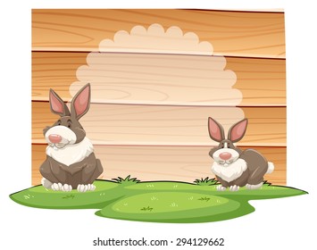 Two rabbits with wooden sign