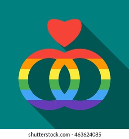 Two rainbow rings and heart icon in flat style on a turquoise background